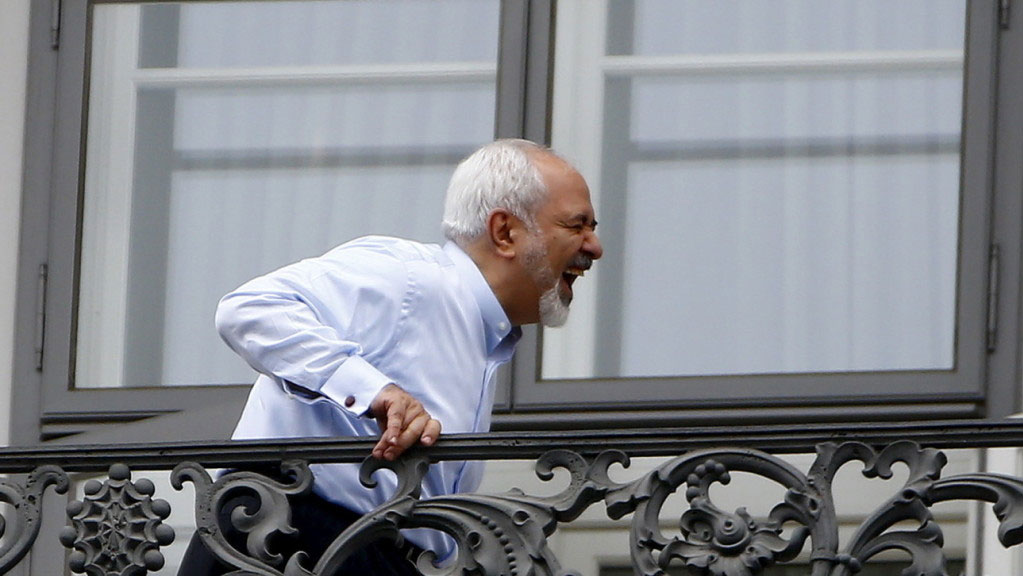 Iranian Foreign Minister Javad Zarif stands on the balcony of Palais Coburg, the venue for nuclear talks, Austria, July 13, 2015. Iran and six world powers appeared close to a deal on Monday to give Tehran sanctions relief in exchange for limits on its nuclear programme, but Iranian officials said talks could run past their latest midnight deadline and success was not guaranteed. REUTERS/Leonhard Foeger TPX IMAGES OF THE DAY - RTX1K8UH